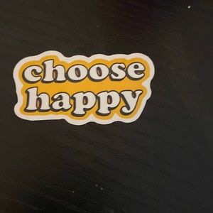 There is a cumputersticker, mochi, and Ipsy bag